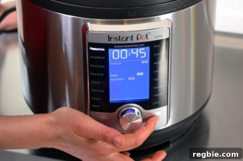 An Instant Pot Ultra display is pictured that is being programmed to cook for 45 minutes under high pressure.