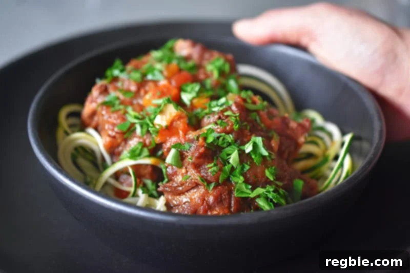 A final closeup of Instant Pot Oxtail Stew over zucchini noodles.