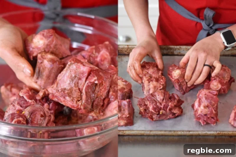 The oxtails are tossed by hand and then placed in a single layer on a rimmed baking sheet.