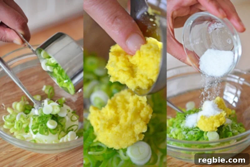 Scallions, minced ginger, and salt are combined in a small bowl, ready for mixing.