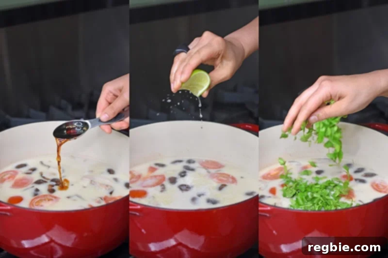 Adding fish sauce, lime juice, and fresh herbs to healthy Whole30 Tom Kha Gai for final seasoning.