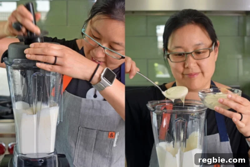 Blending the No-Bake Matcha Cheesecake filling until silky smooth, then scooping out a portion to set aside for swirling.