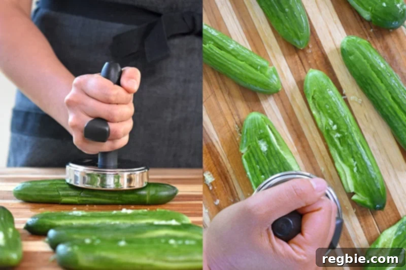 Smashing salt covered cucumbers on a wooden cutting board with a meat pounder.