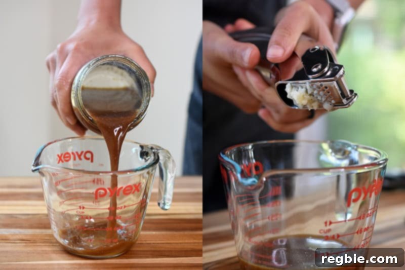 Pouring all-purpose stir fry sauce and smashed garlic into a measuring cup to make the paleo and whole30 dressing.