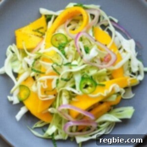 Spicy Mango Cabbage Slaw by Michelle Tam https://nomnompaleo.com