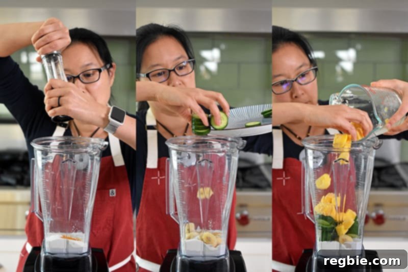 Sun-Kissed Wellness Smoothie 6 Michelle Tam adding the final fresh ingredients – a dash of freshly ground black pepper, hydrating cucumber slices, and sweet frozen mango chunks – into the Vitamix blender, ready to be transformed into a Golden Glow Smoothie.