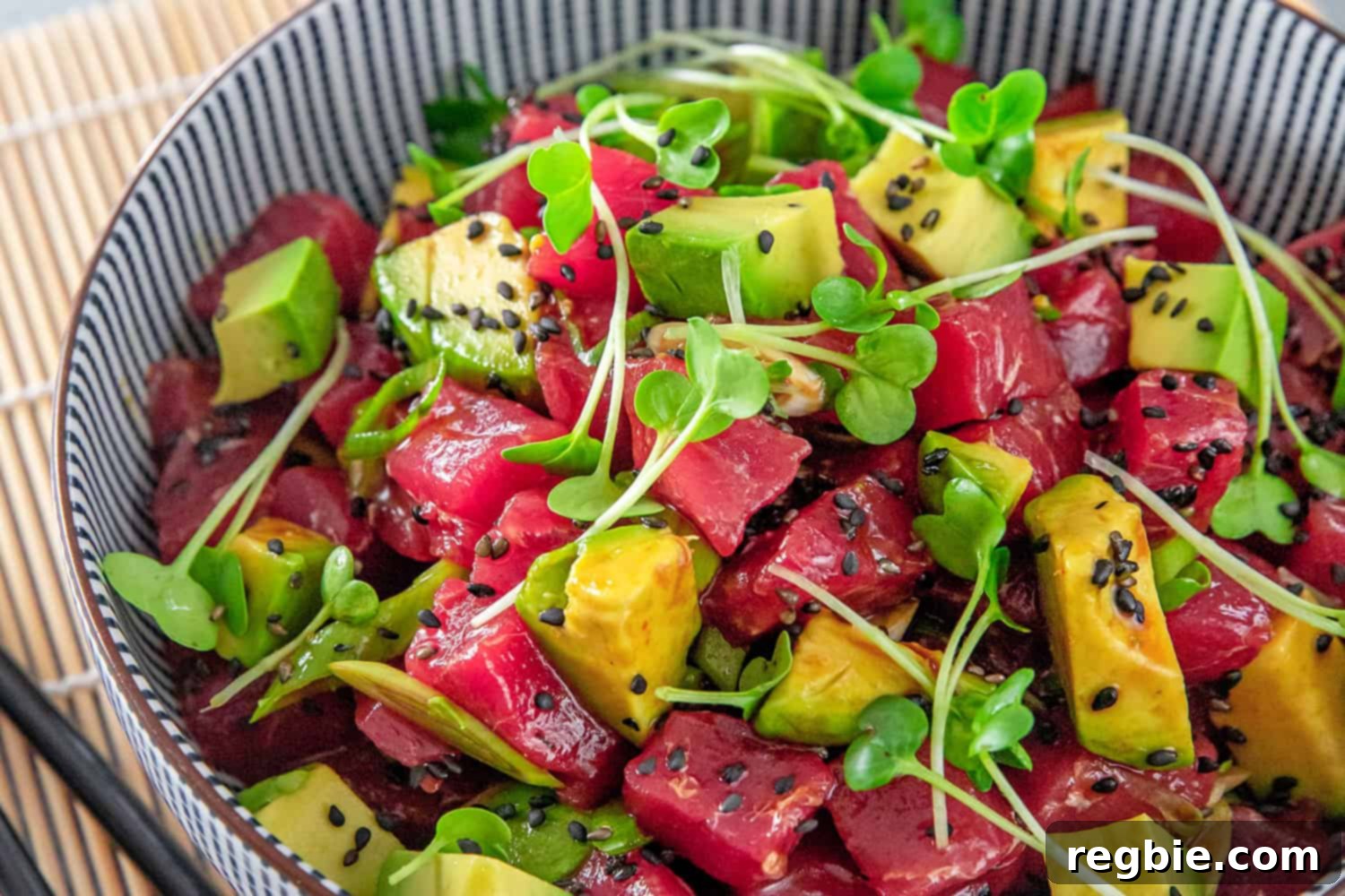 A mouth-watering close-up of Whole30 Tuna Poke with Avocado, beautifully plated and ready to be enjoyed.