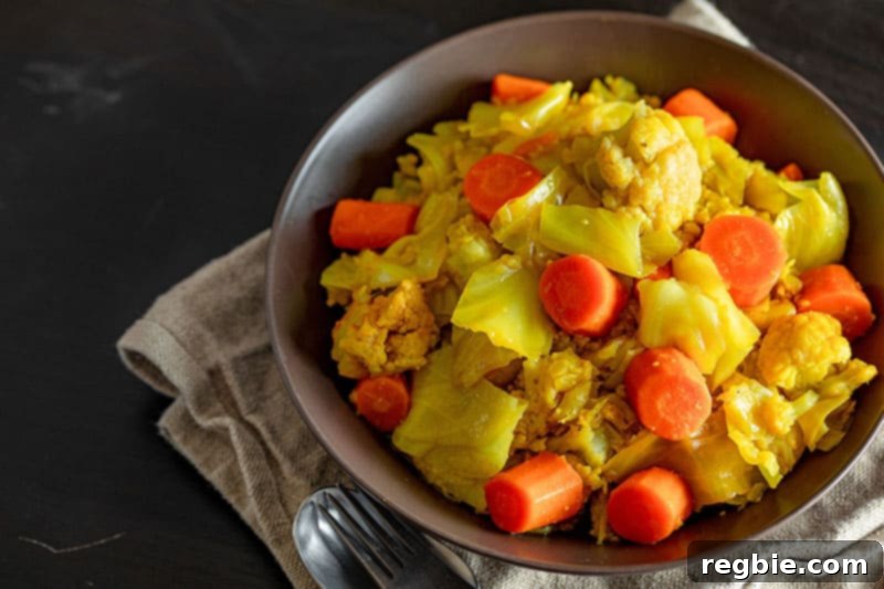 Primal Instant Pot Perfection 8 An overhead shot of a rustic brown bowl filled with Whole30 and low carb Atakilt Wat, a flavorful Ethiopian cabbage stew, ready to be served.
