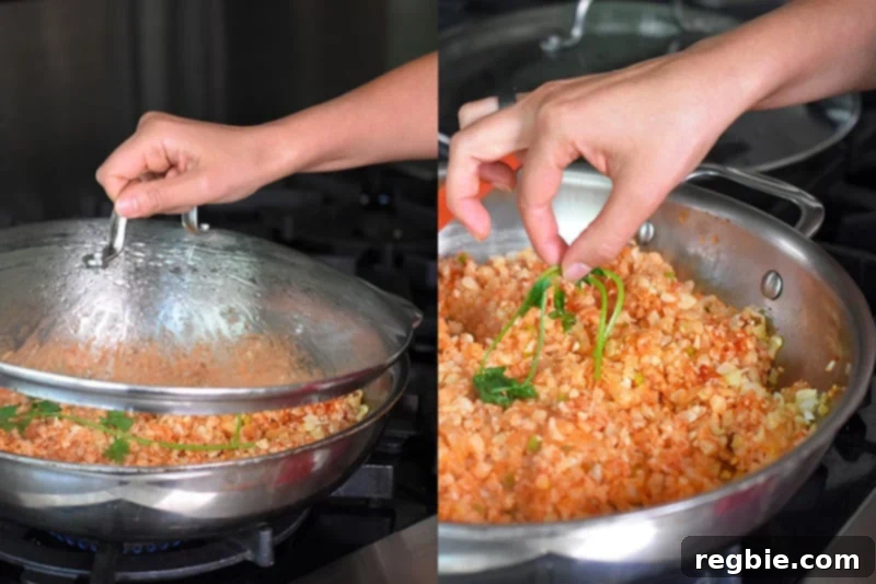 The lid is being removed from the low-calorie Mexican Cauliflower Rice after cooking, and the cilantro sprig is being taken out.
