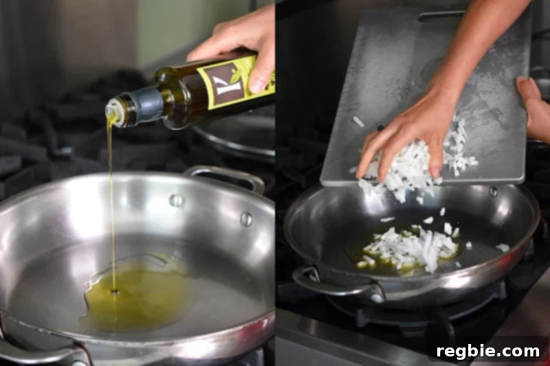 Chopped white onions are sautéing gently in olive oil within a large skillet, forming the base for delicious Mexican Cauliflower Rice.