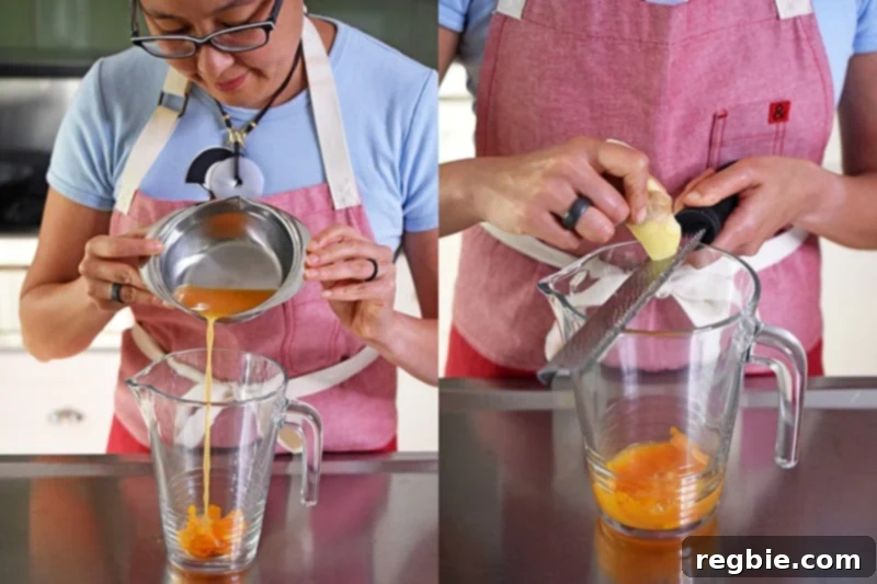 An Asian woman in glasses is pouring fresh squeezed orange juice and freshly grated ginger into a pitcher.