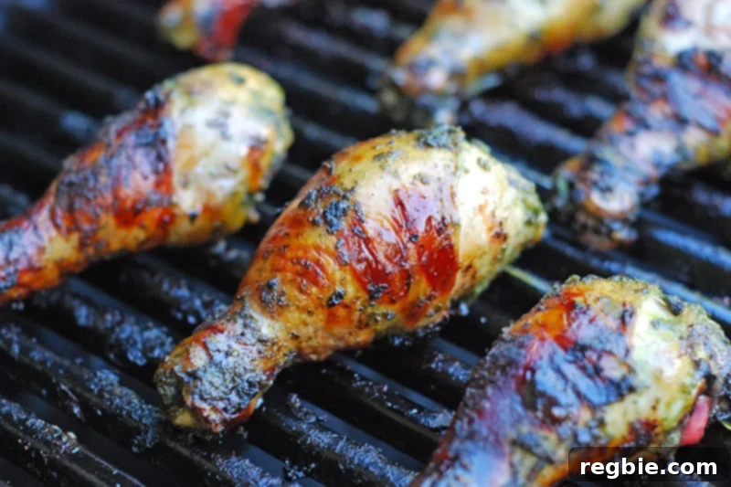 Fiona’s Phenomenal Grilled Green Chicken cooking to perfection on a hot grill, showing a beautiful char.