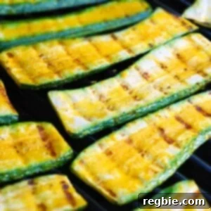 Zucchini grilling on a grill.