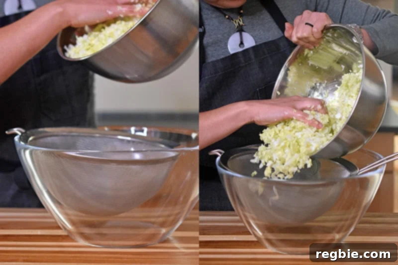 The salted napa cabbage is transferred to a fine mesh sieve over a clear bowl.