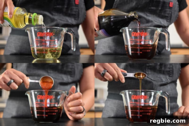 A liquid measuring cup is filled with rice vinegar, coconut aminos, sesame oil, and sriracha to make Paleo Pot Sticker dipping sauce.
