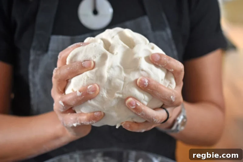 Handling a ball of wrapper dough for Paleo Pot Stickers
