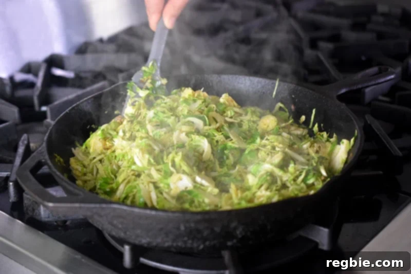 Crispy Bacon Brussels Sprouts 11 Sautéing shaved Brussels sprouts and shallots in a large cast iron skillet until tender-crisp.