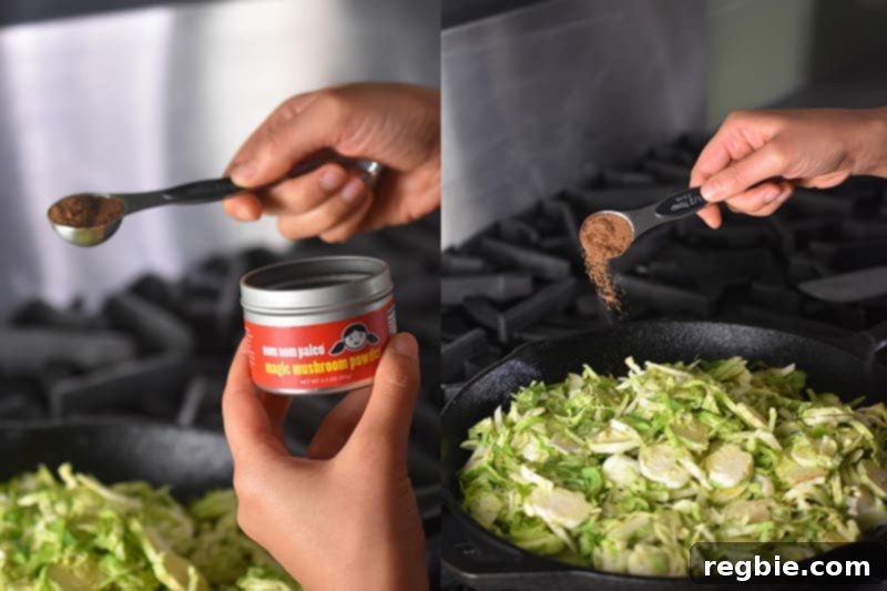 Crispy Bacon Brussels Sprouts 10 Seasoning the shaved Brussels sprouts with Nom Nom Paleo's Magic Mushroom Powder in a cast iron skillet.