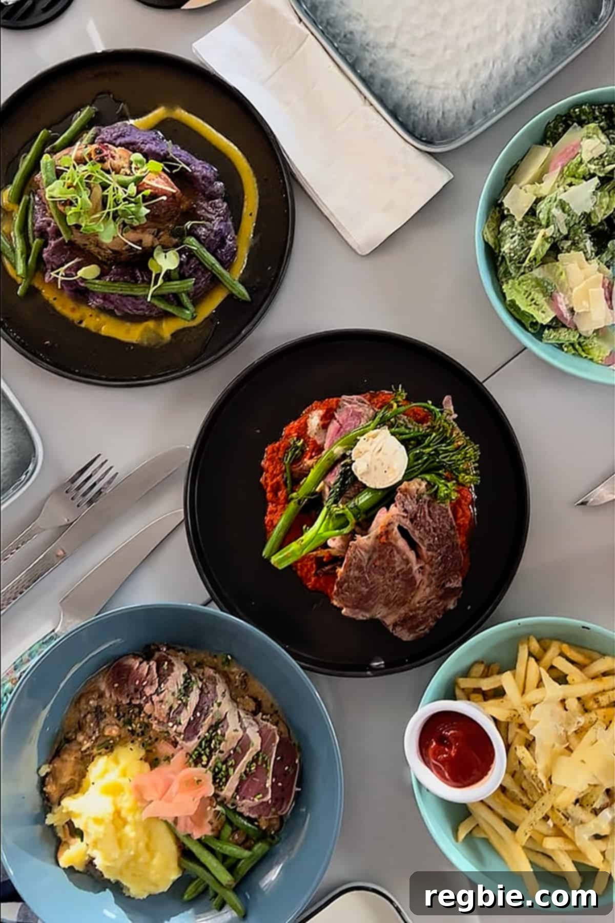 An overhead shot of gluten free dishes at Mala Ocean Tavern in Maui.