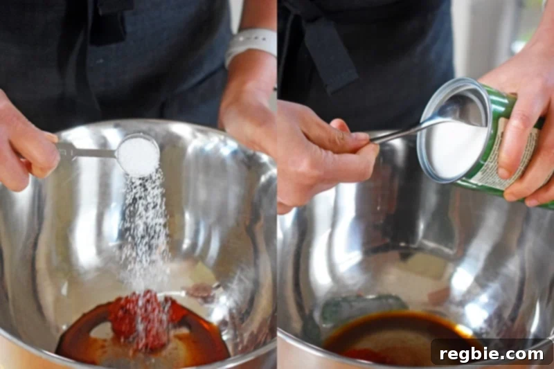 Close-up shot of the initial sauce ingredients - curry paste, coconut milk, fish sauce, coconut aminos, and salt - being added into a large metal mixing bowl.