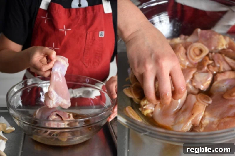 Adding boneless chicken thighs to the prepared marinade, ensuring each piece is fully coated.