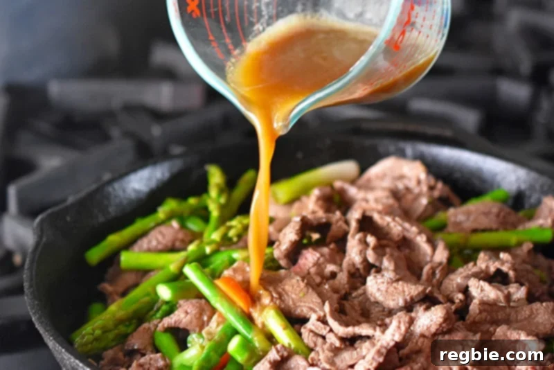 A vibrant, healthy stir-fry coated in a delicious sauce, showcasing the perfect meal.
