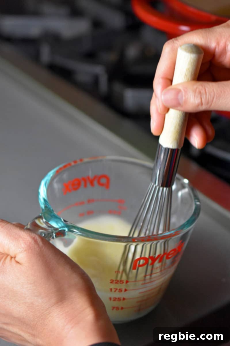Zesty Whole30 Gluten Free Hot and Sour Soup 8 Whisking arrowroot powder with the reserved broth in a small measuring cup to create a thickening slurry for the soup.