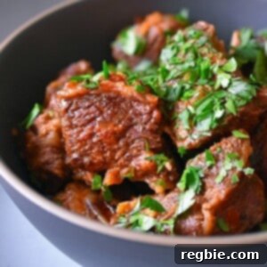 A side view closeup of a bowl of Instant Pot Magic Short Ribs, ready to be enjoyed.