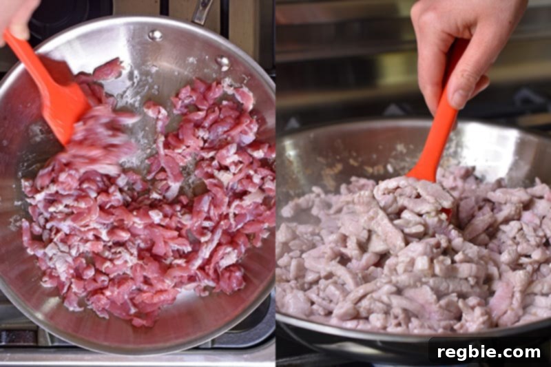 Cooking the pork strips in a large skillet until they are no longer pink.