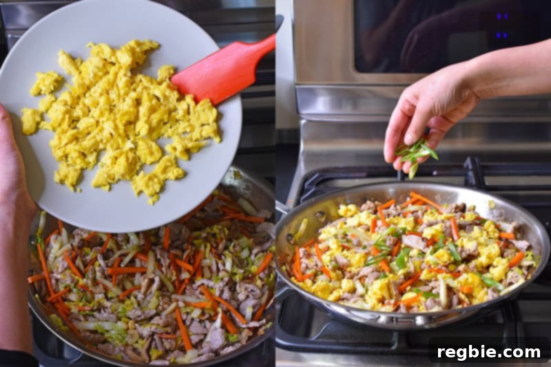 Adding the reserved scrambled eggs and sliced scallions to the skillet.