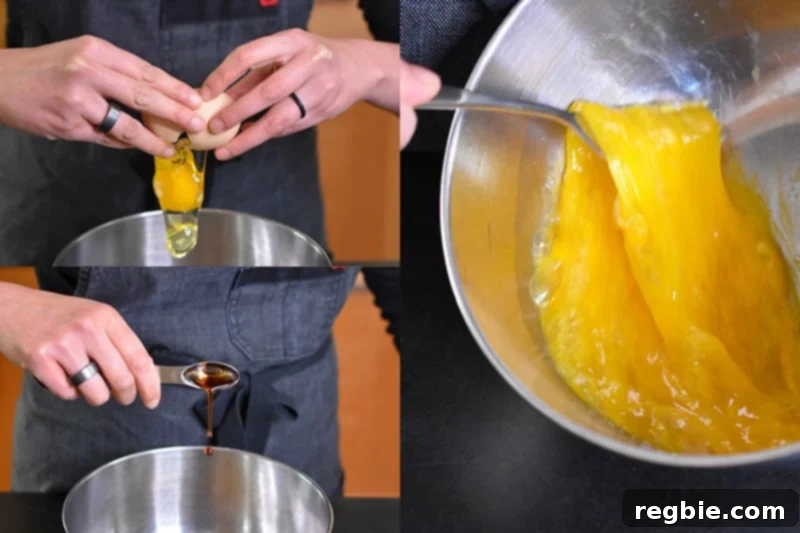 Whisking eggs with fish sauce with a fork in a metal bowl.