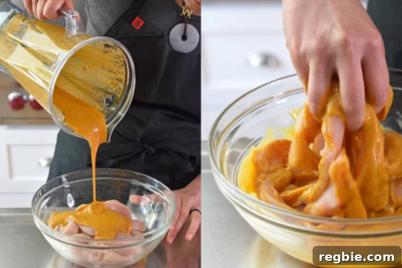 Pouring the marinade over the chicken strips and mixing everything with bare hands to ensure even coating.