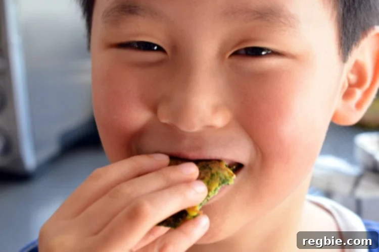 Wholesome Whole30 Keto Egg Foo Young 12 A cute Asian boy is happily eating a paleo Egg Foo Young.
