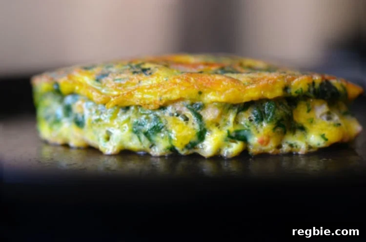 Wholesome Whole30 Keto Egg Foo Young 4 A side view of Egg Foo Young-ish (Spinach, Egg, Ham & Coconut Pancakes) on a plate.