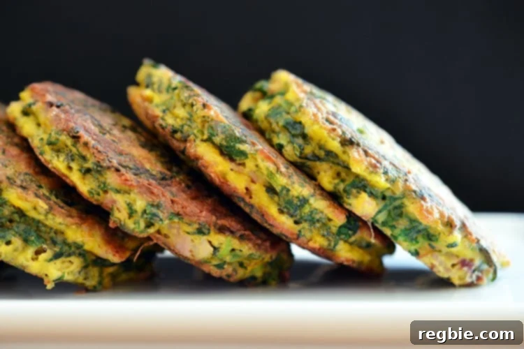 Wholesome Whole30 Keto Egg Foo Young 5 A plate of Egg Foo Young (Spinach, Egg, Ham & Coconut Pancakes) tipped on the side.