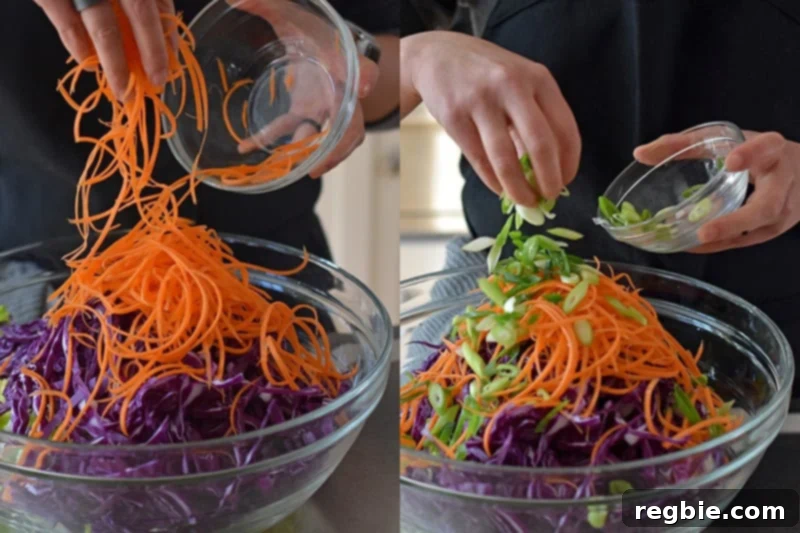 Combining the vegetables in a large bowl to make Whole30 Chinese Chicken Salad.