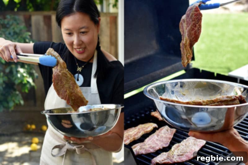 Classic Korean BBQ Kalbi 11 An Asian woman is grabbing marinated paleo kalbi with a pair of tongs and placing them on the grill.