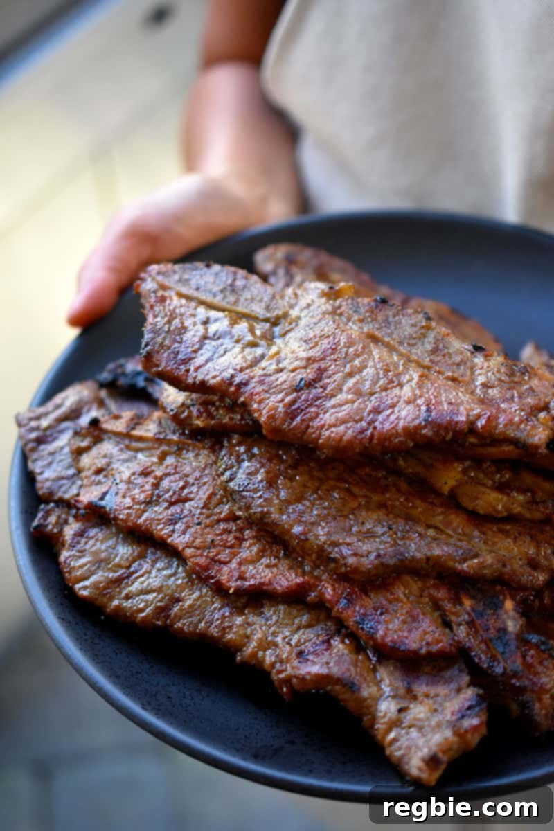 Classic Korean BBQ Kalbi 13 A platter filled with paleo galbi cooked in the oven.