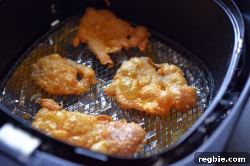 An overhead shot of air fryer Chicken Cracklings that are golden brown and crispy, perfectly cooked.