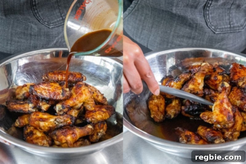 Pouring the reserved Whole30 marinade over the freshly baked, gluten-free Chinese Chicken Wings for a final, irresistible sticky glaze.
