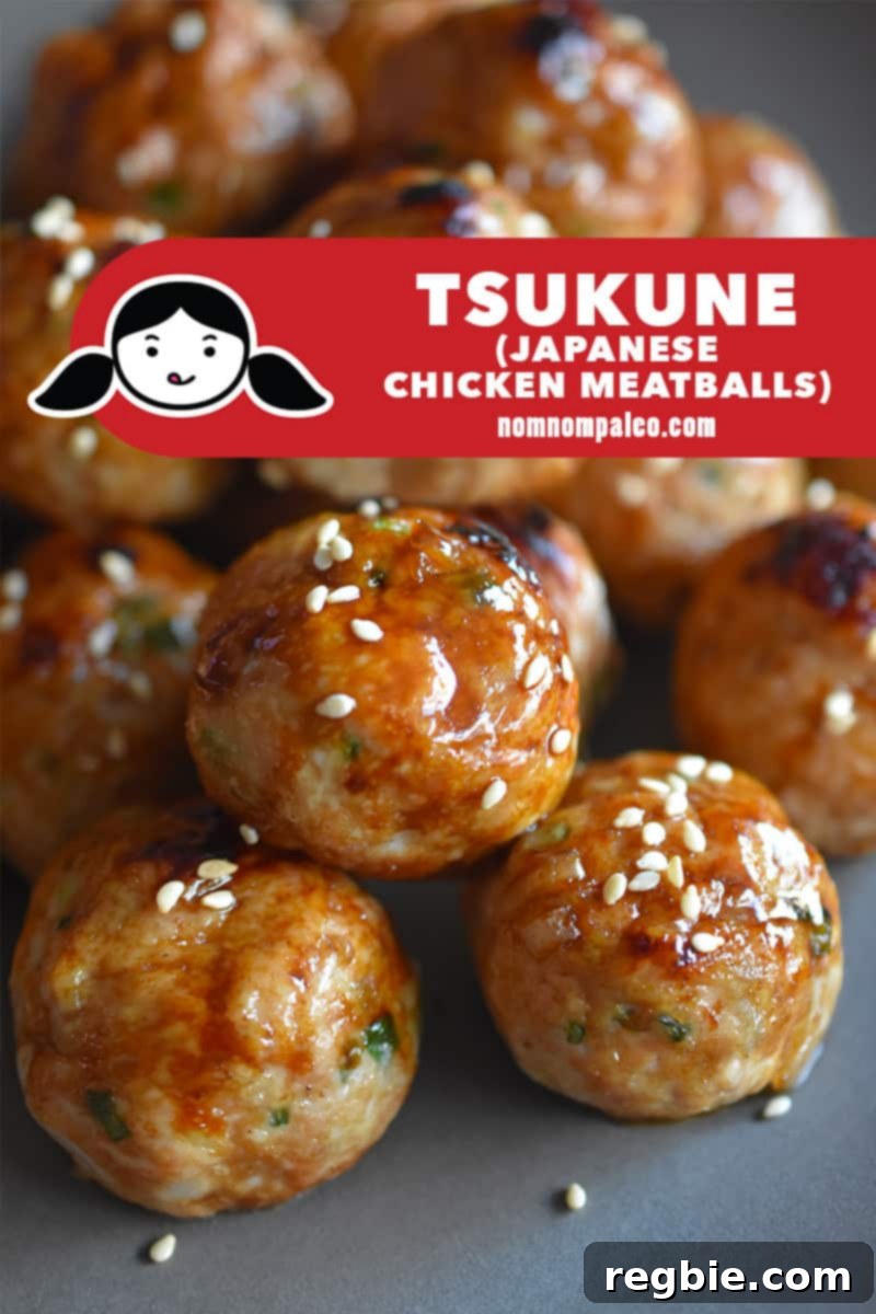 A platter of healthy Whole30 tsukune, Japanese chicken meatballs, garnished with sesame seeds.