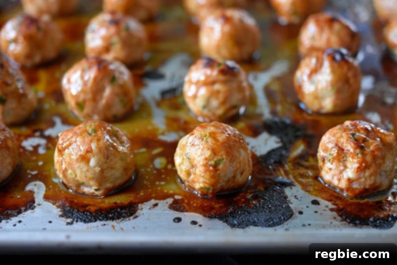 Baked Whole30 Tsukune that are nicely browned on top, showing their delicious glaze.