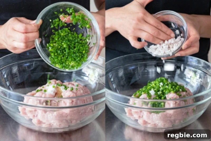 Adding minced scallions and diced shallots to the Whole30 tsukune chicken meatball mixture in a large bowl.