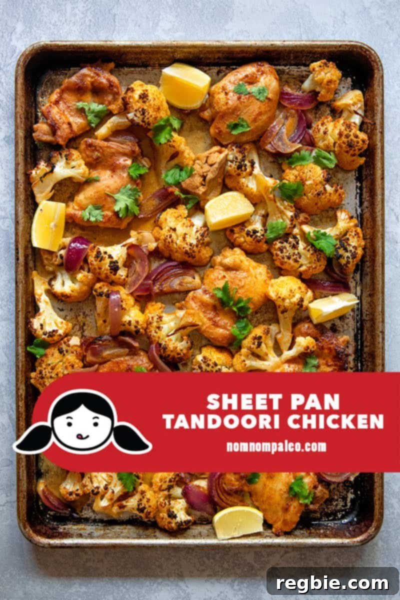 An overhead shot of quick and easy sheet pan tandoori chicken with cauliflower, a simple Whole30 and keto dinner.