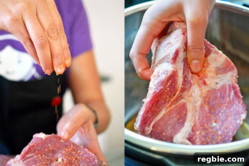 Seasoning the pork shoulder pieces for Instant Pot Kalua Pig with red alaea Hawaiian salt, preparing for cooking.