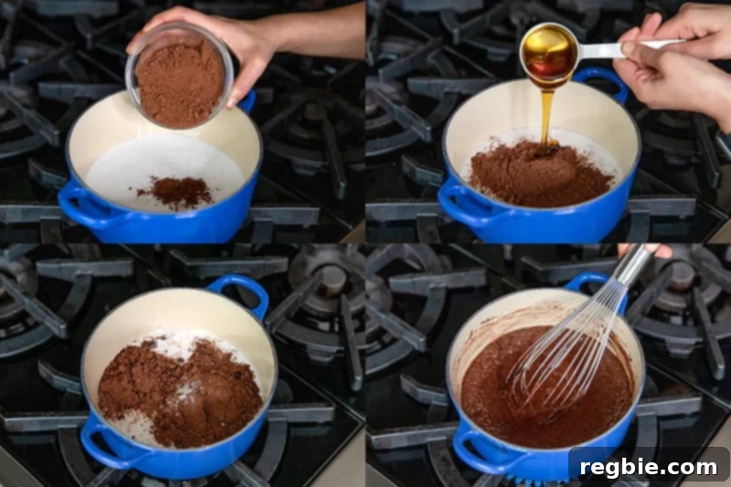 Heavenly Paleo Chocolate Pudding 5 A blue sauce pan is filled with the ingredients to make paleo chocolate pudding: coconut milk, cocoa powder, honey, salt, and vanilla.