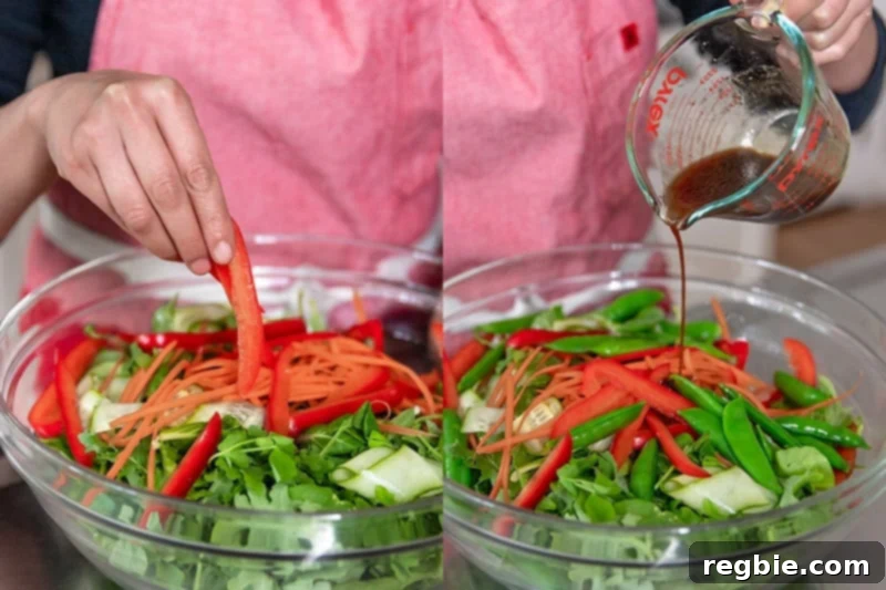 Adding the vegetables for Asian Steak Salad to a large salad bowl and pouring in the All-Purpose Stir-Fry Sauce.