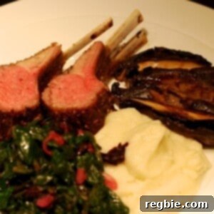 A plate of Whole30 roasted rack of lamb with a side of mashed cauliflower puree.