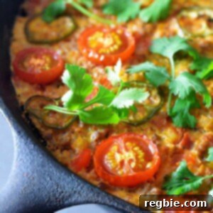 A closeup shot of Tex-Mex Beef and Rice Casserole, a Whole30-friendly one pan meal that you can make in a cast iron skillet.