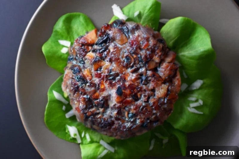 Paleo Big-O bacon burger served in fresh lettuce leaves for a low-carb option.